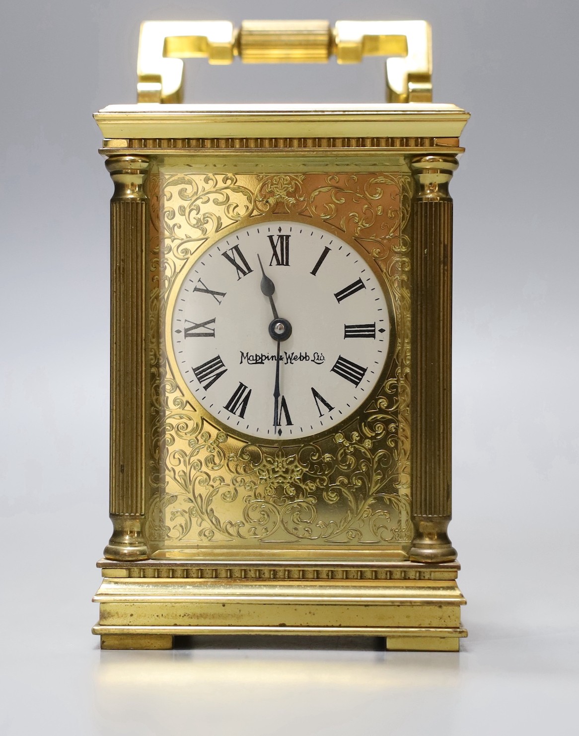 A French brass carriage timepiece, Mappin & Webb, 11.5 cms high.